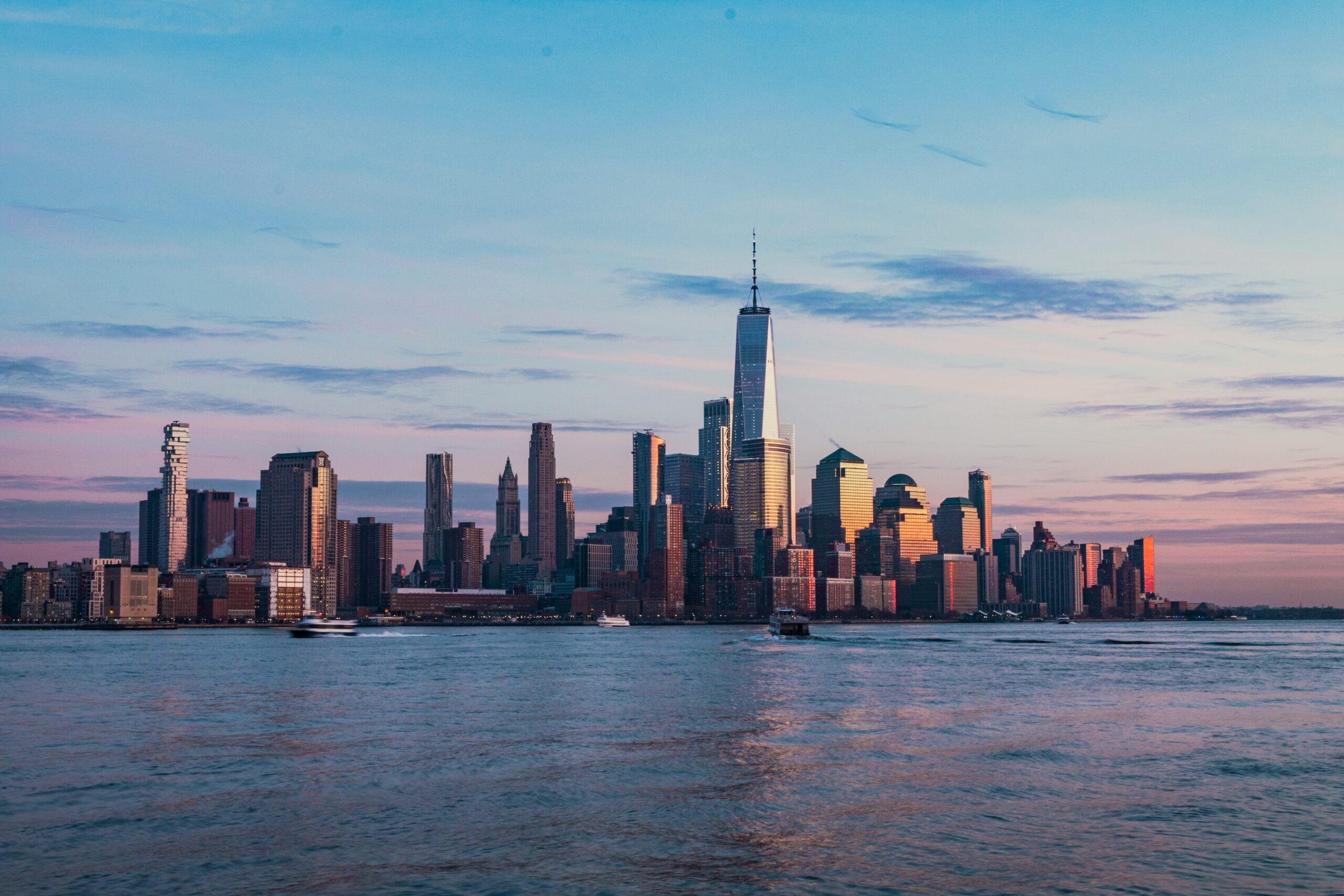 An image of skyscrapers in NYC at sunset